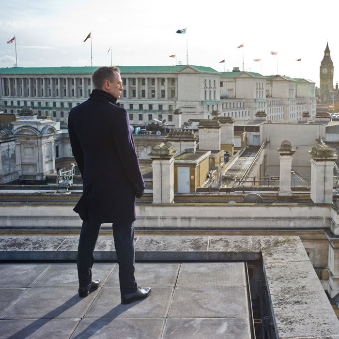 Daniel Craig as James Bond on a rooftop overlooking London