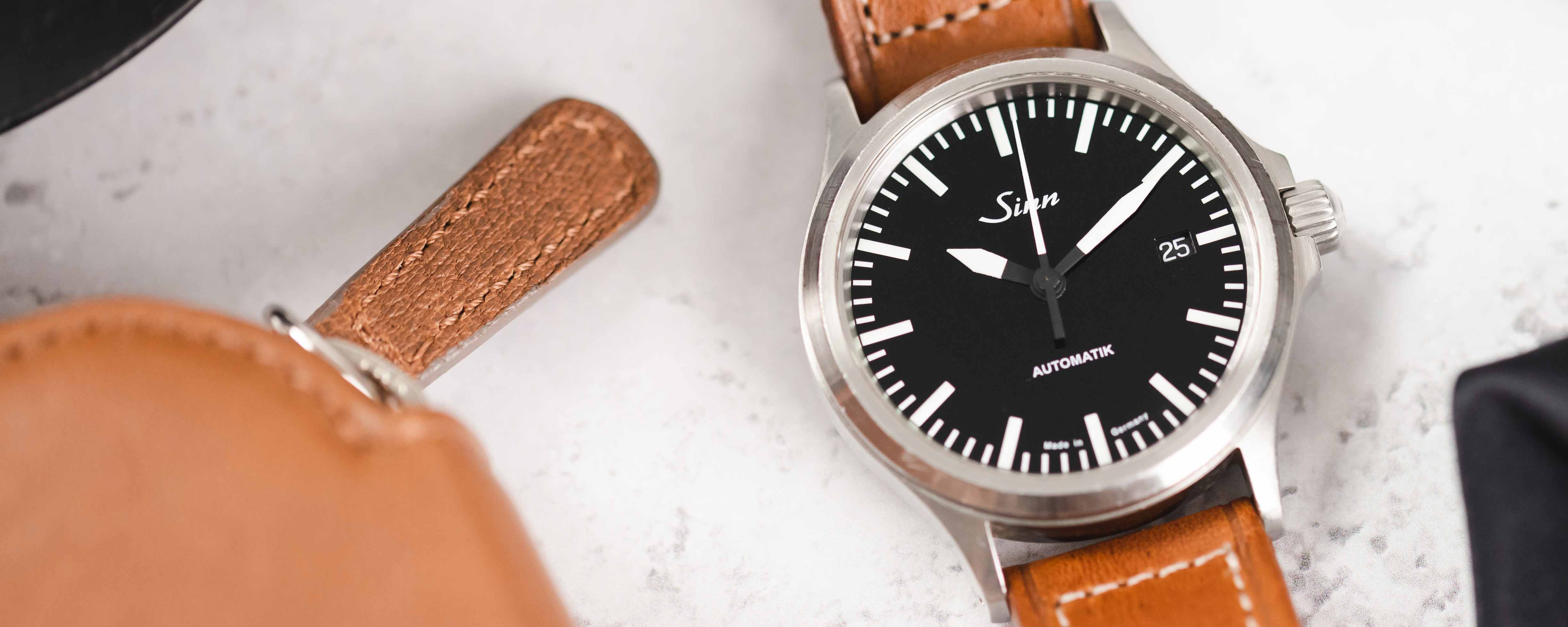 Sinn Watches - 104 St Sa I – the classic pilot watch. Worn with grey canvas  leather strap on a 7.3