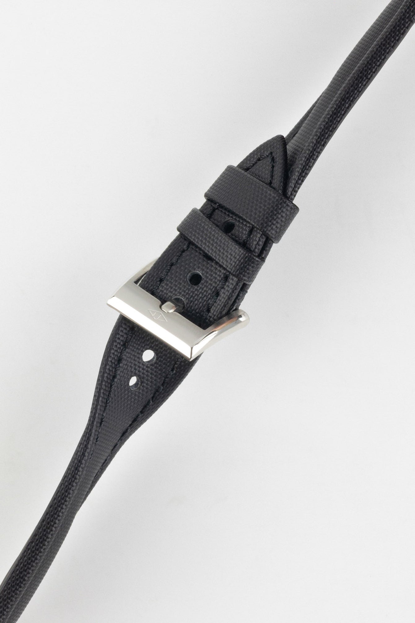 Black Artem Classic Sailcloth strap buckled and twisted to show flexibility and durability. 