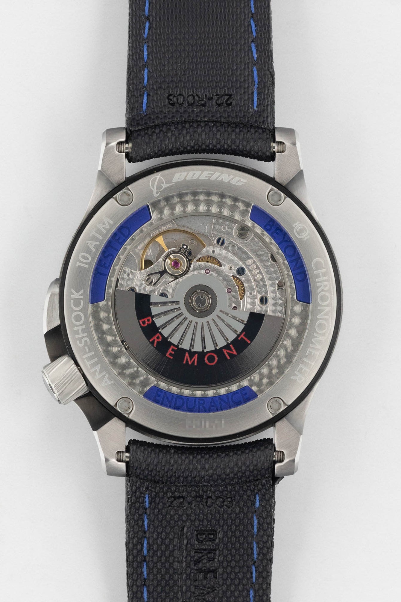 Open case back of the Bremont watch showing the inner working of the automatic mechanism and Bremont motto: Tested Beyond Endurance