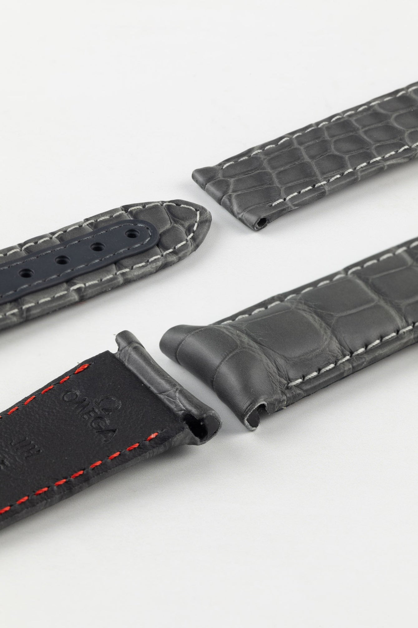 Photo Showing ends of Omega Watch Strap, image shows deployment end and tang with the springbar holes. Product code CUZ004450