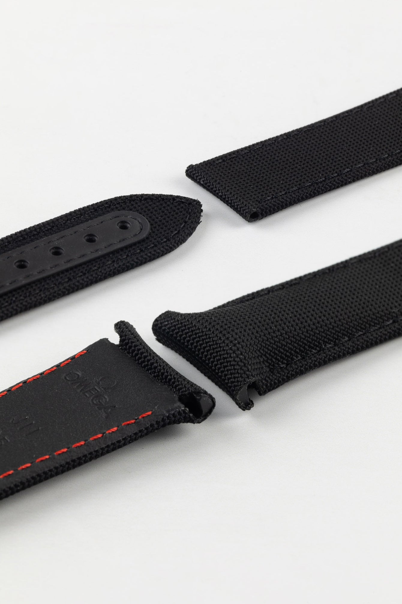 Photo Showing ends of Omega Watch Strap, image shows deployment end and tang with the springbar holes. Product code CWZ003216