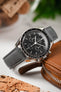 Macro Photography of Omega Speedmaster Pro on Lambskin Merino Strap in Gray with flecto on the hesalite glass