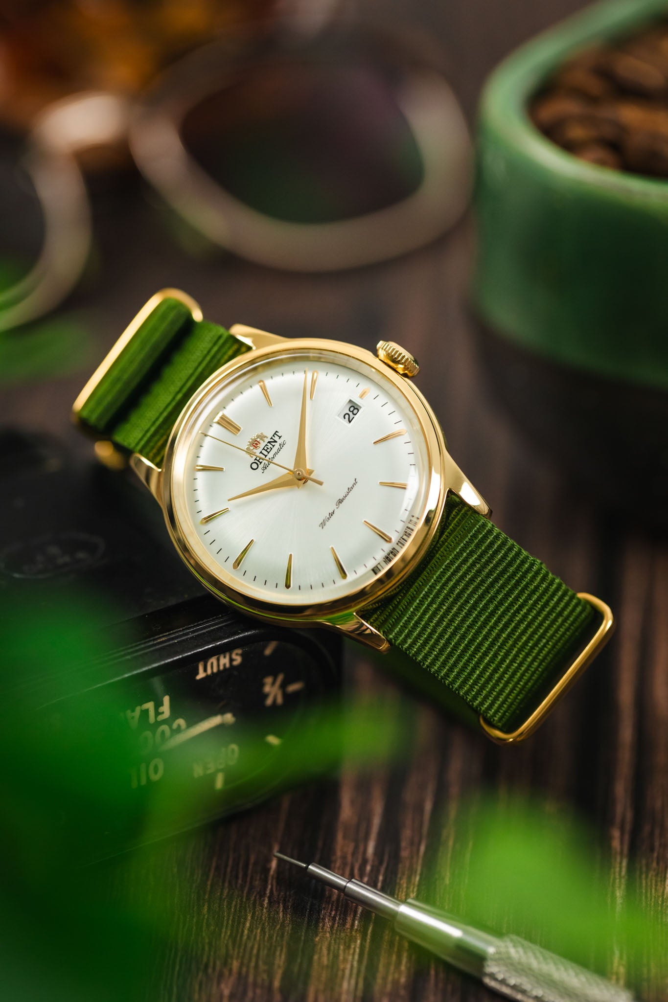 Gold and green watch best sale