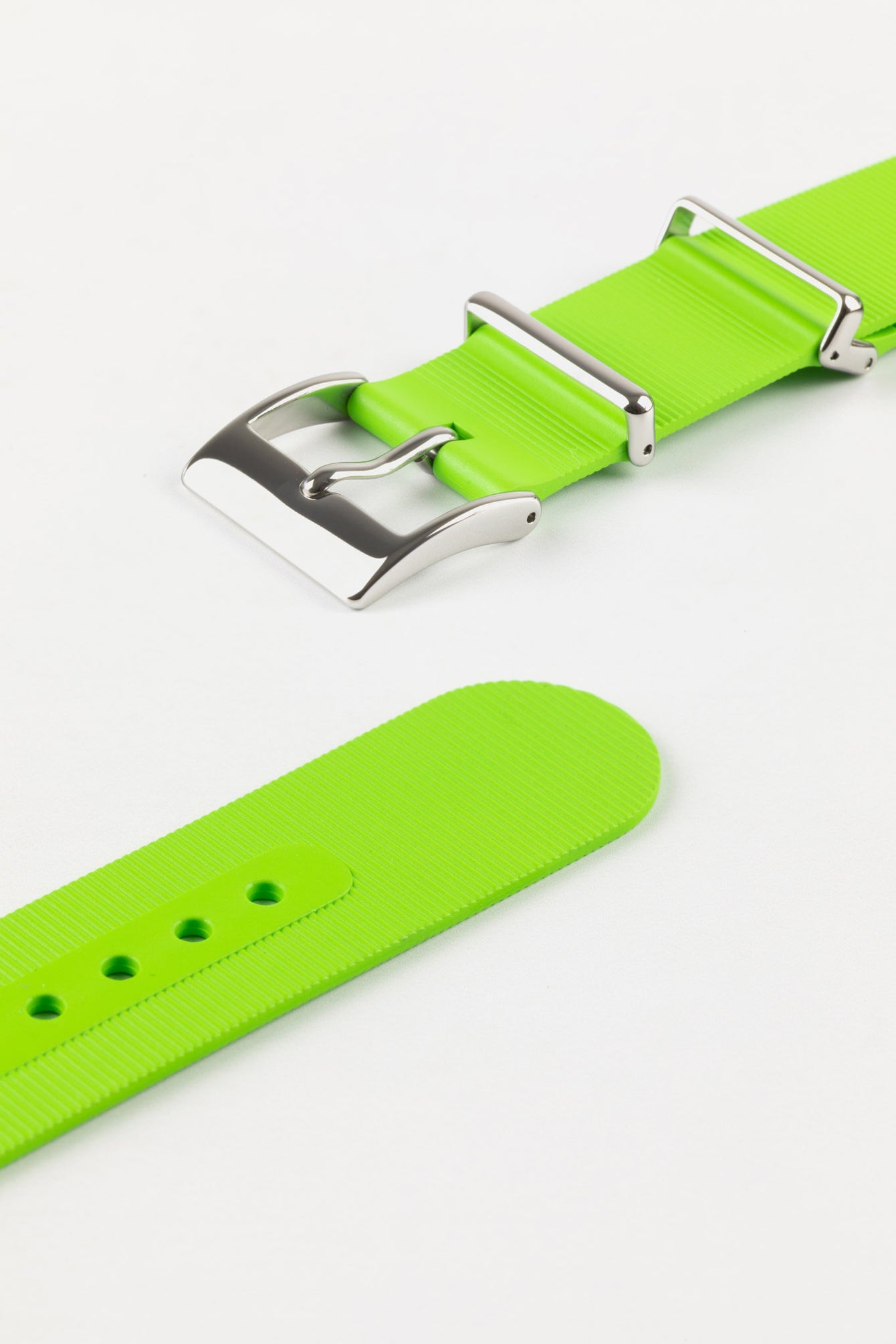 Buckle and tail end of lime green bonetto centurini 328 strap with polished silver buckle