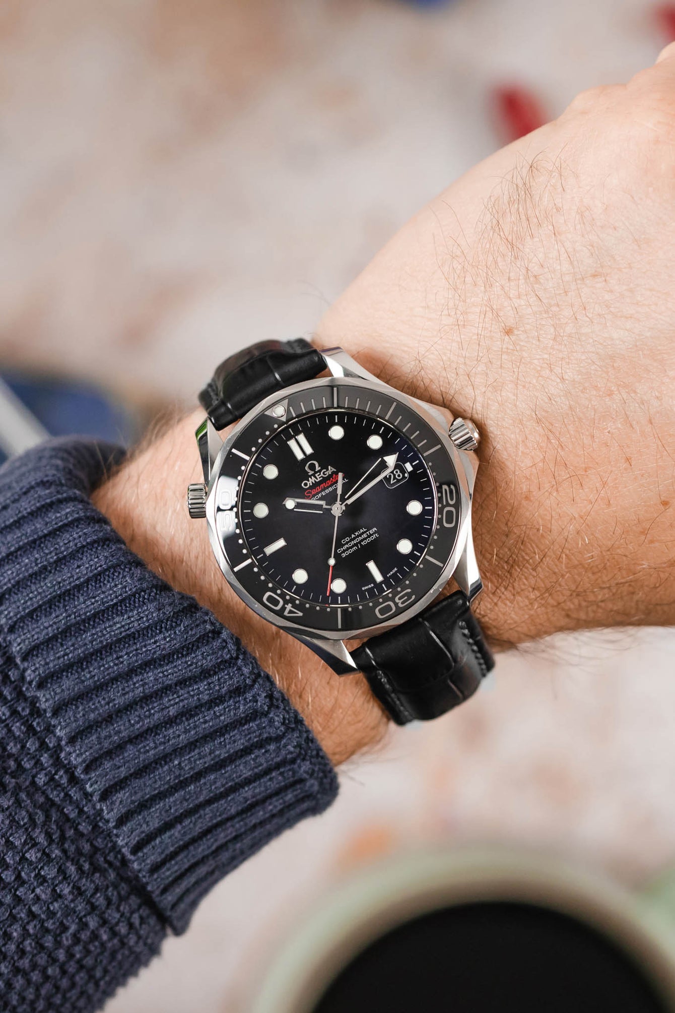 Omega Seamaster Professional SMPc Black Ceramic fitted with Hirsch Grand Duke black alligator watch strap worn on wrist