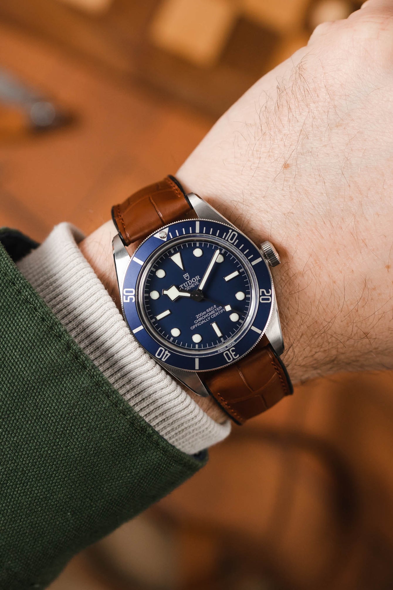 Blue Tudor Black Bay 58 fited with Hirsch Ian Gold Brown Alligator watch strap worn on wrist